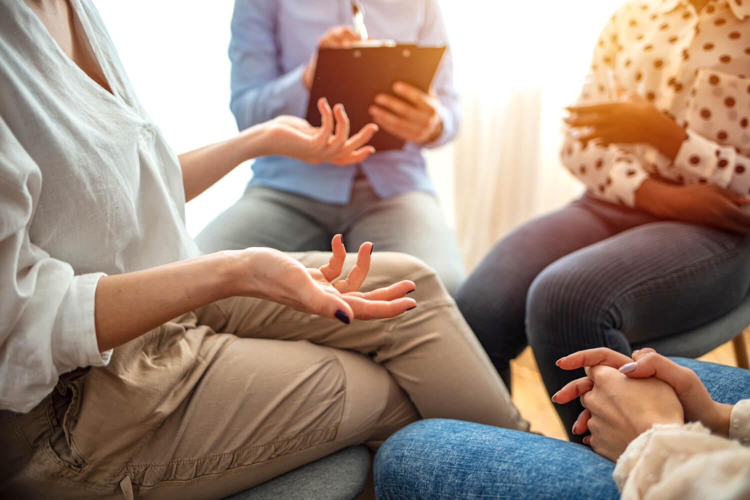 Group of people talking in a circle