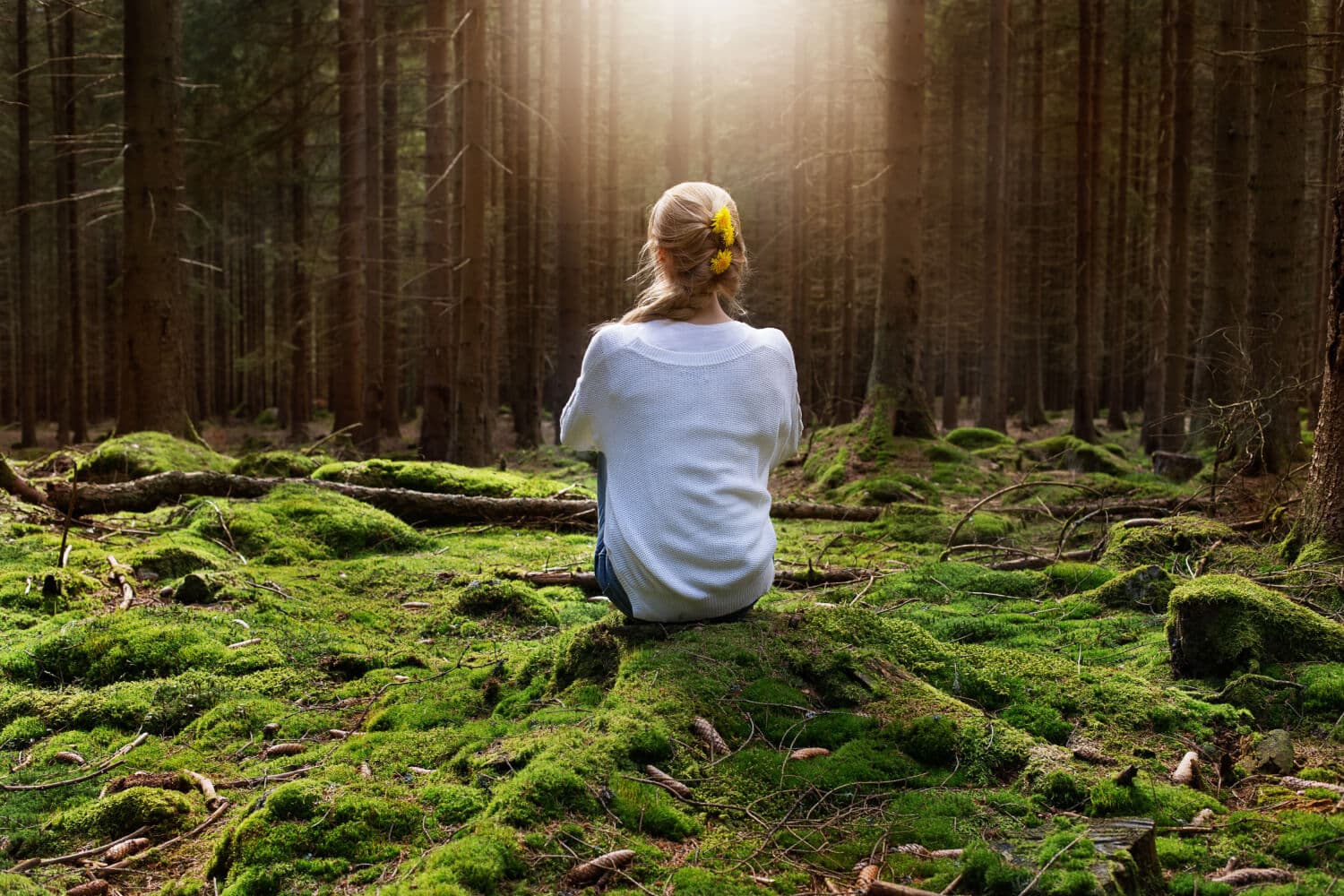 Woman sitting peacefully in the wilds